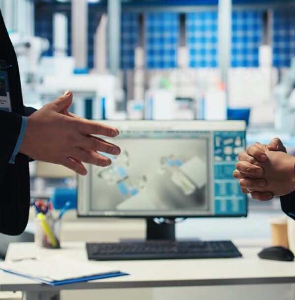 Photovoltaics factory manager and investor shaking hands, reaching agreement for producing sustainable green energy. Businessmen in solar panels facility finalize partnership with handshake
