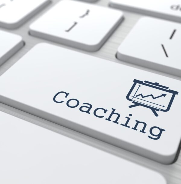 Business Concept. "Coaching" Button on Modern Computer Keyboard.